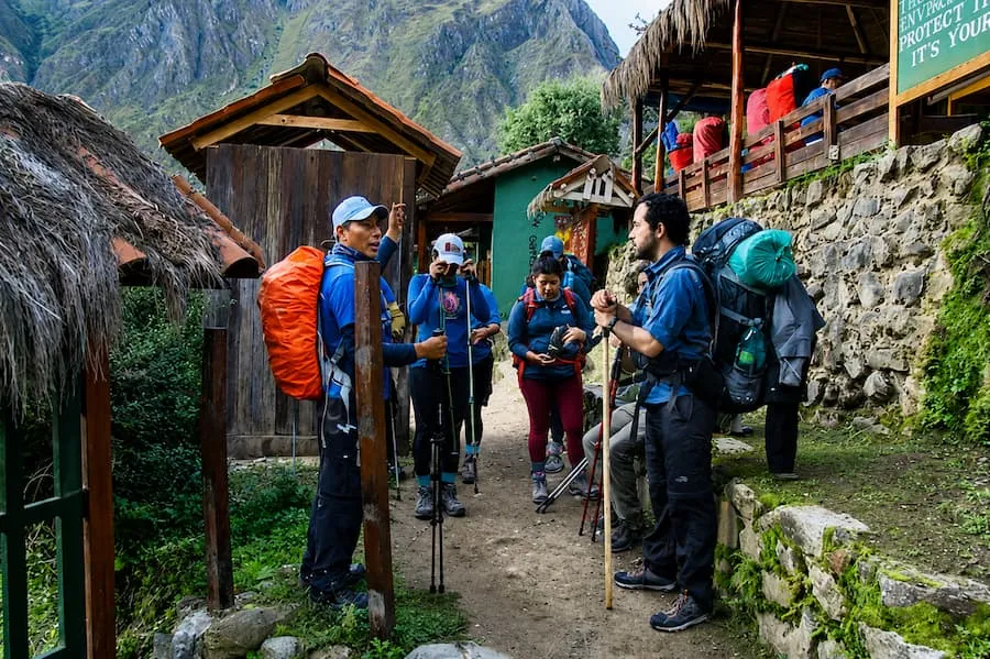 Trekkers gathered at a control point on the Inca Trail