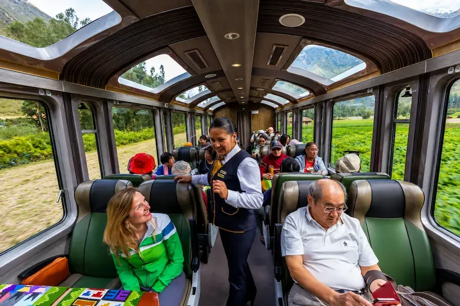 Passengers looking out of the panoramic windows of the Vistadome train