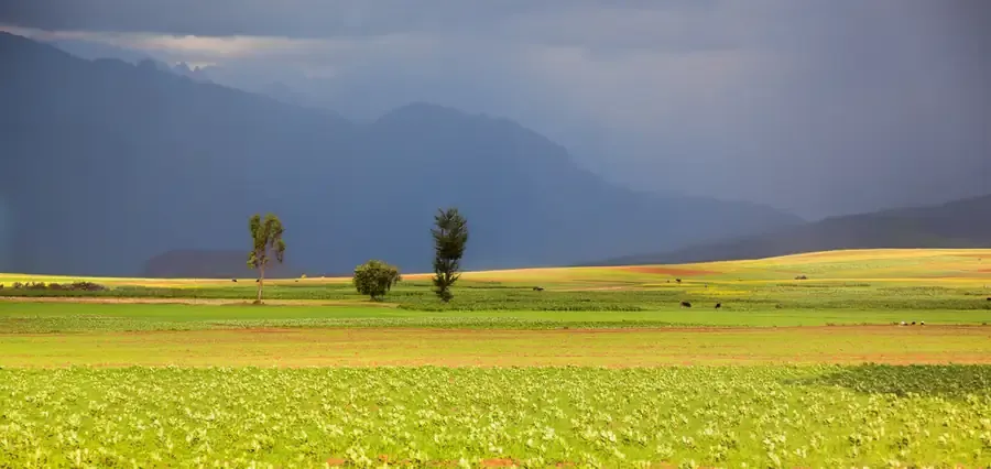 Storm clouds over the patchwork fields of the Sacred Valley