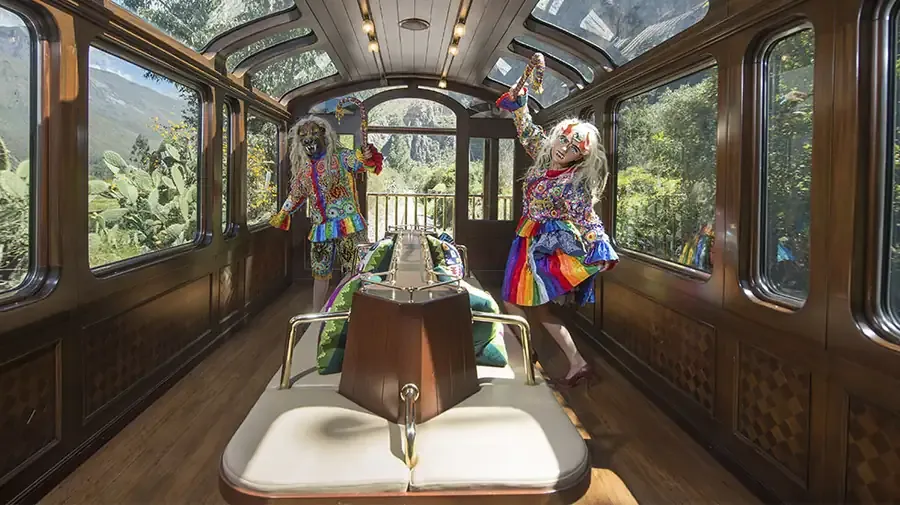 Dancers in traditional costume performing on board the Vistadome train