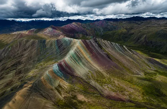 Striped green, red and ochre ridges of the Palccoyo range
