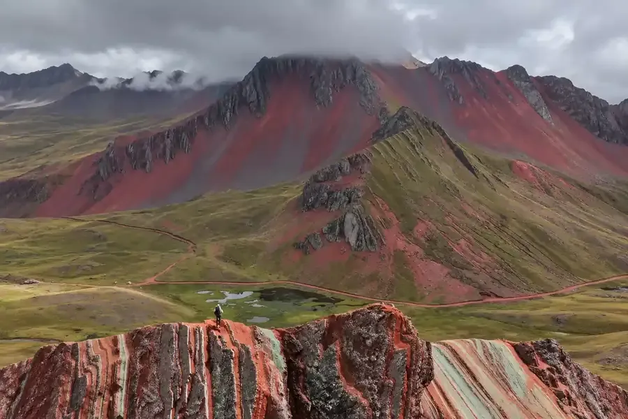 Striped ridge of Pallay Punchu with the lake in the distance