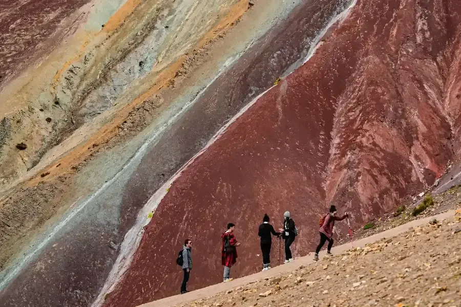 Hikers on the colored slopes of Vinicunca