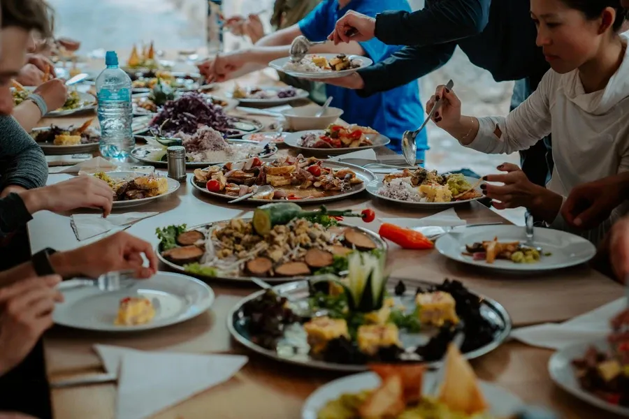 Long table of Andean dishes served by the trail kitchen crew