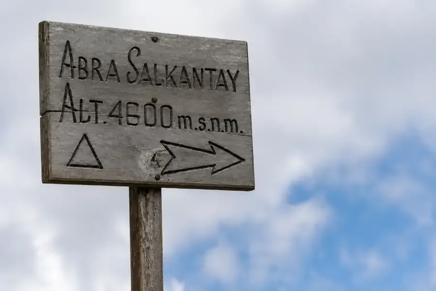 Wooden sign marking the Salkantay Pass at 4,600 m